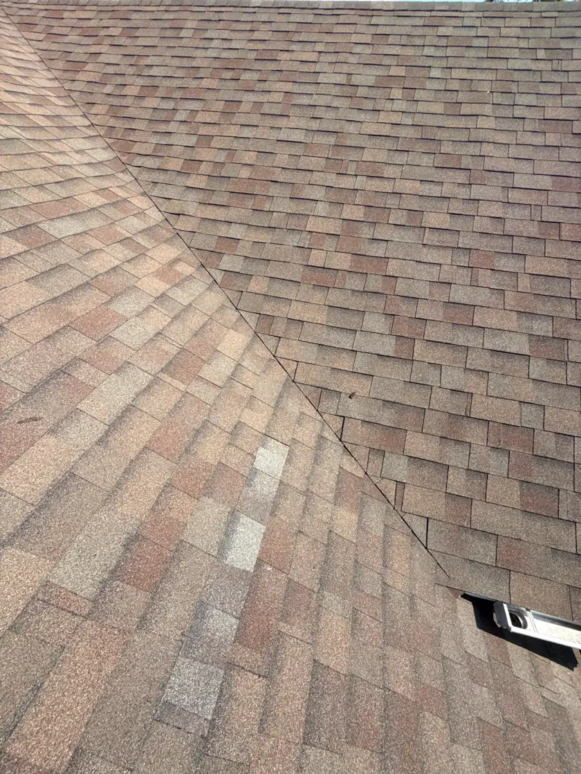 Close view of a freshly installed architectural asphalt shingle roof on a Houston-area home