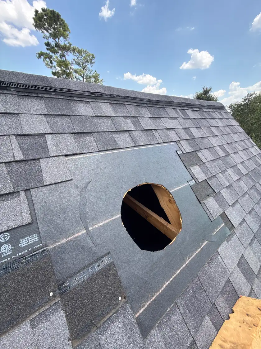 New synthetic underlayment and shingles being installed on a Cypress, TX roof